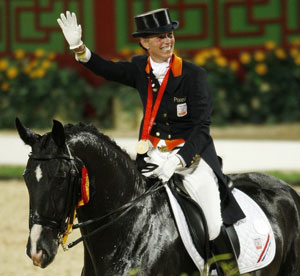 Anky Van Grunsven celebrates her third Olympic Dressage gold medal